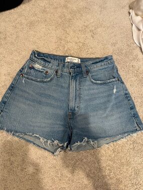 High-Rise Light Blue Distressed Denim Shorts